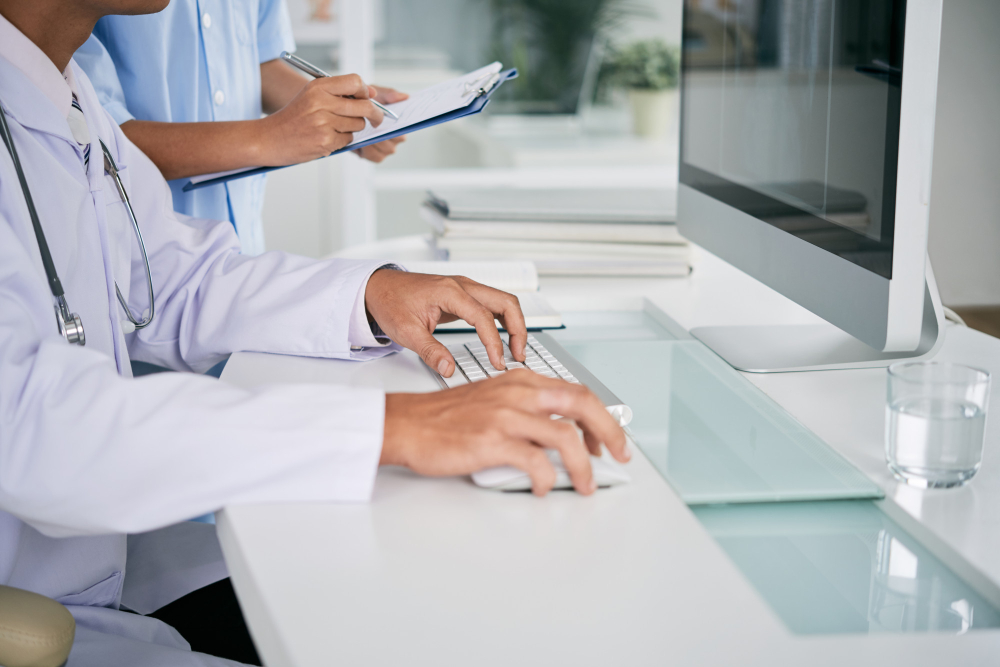 Doctor auditing medical coding records