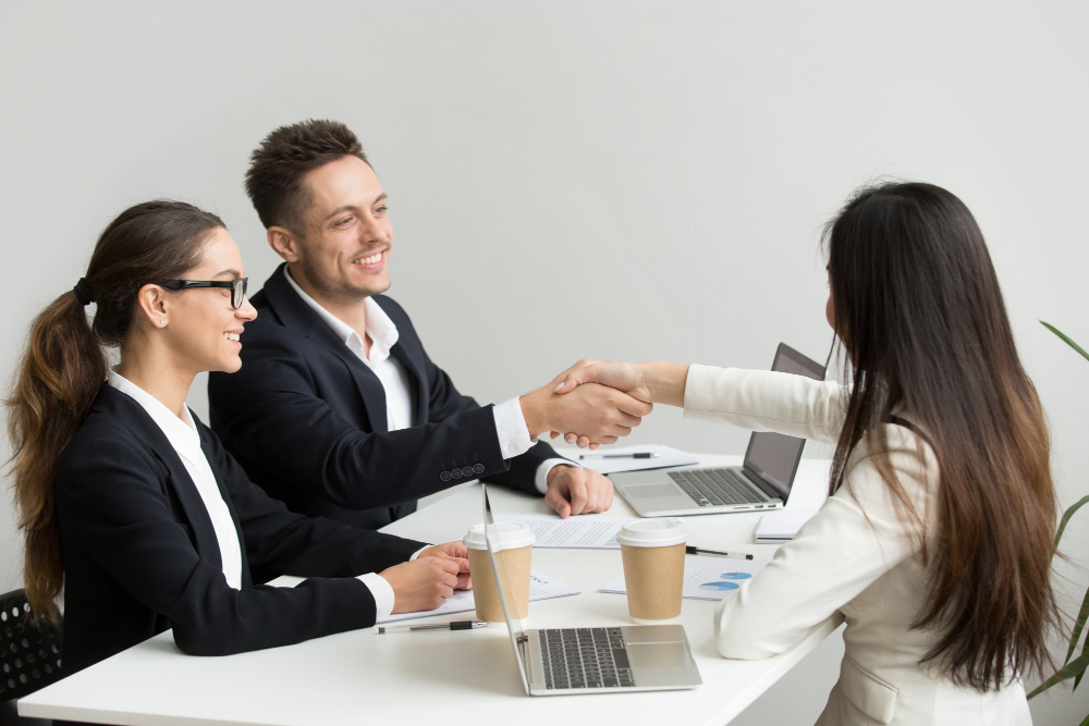 Interviewer Handshaking a girl candidate